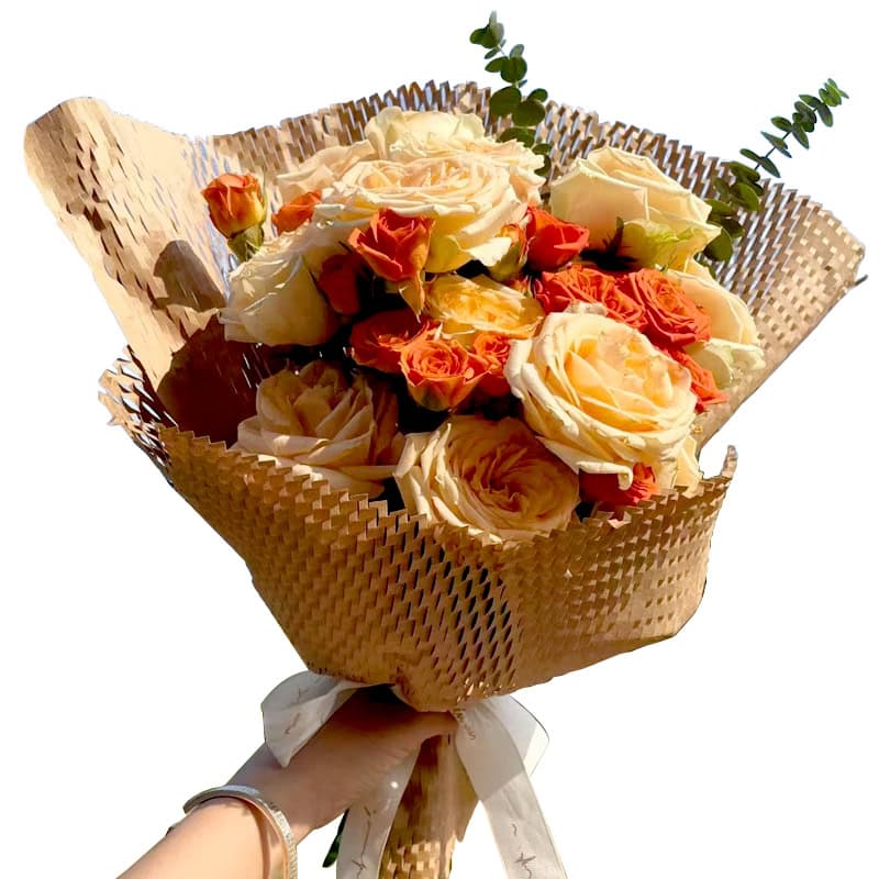 A bouquet of flowers wrapped in honeycomb eco-friendly paper