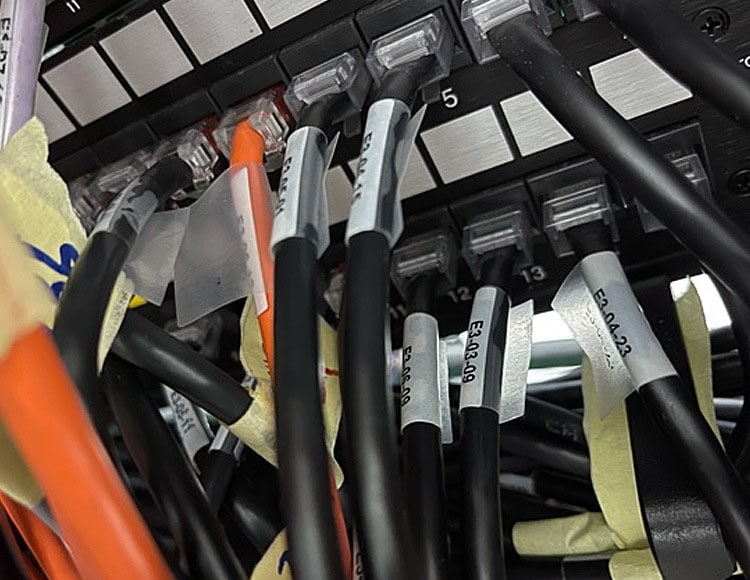 Cables labeled with self-laminating cable labels